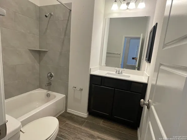 a view of a room with wooden floor and staircase