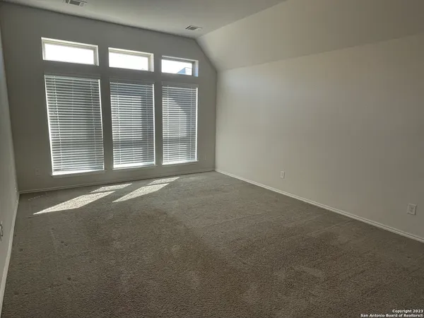 wooden floor and window in an empty room