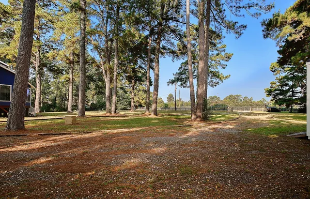 a view of a house with a big yard