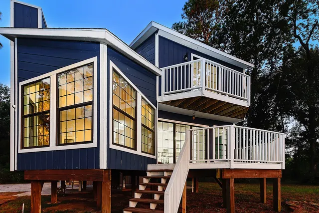 a front view of a house with a deck