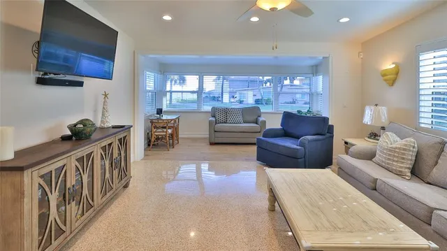 a living room with furniture and a lamp