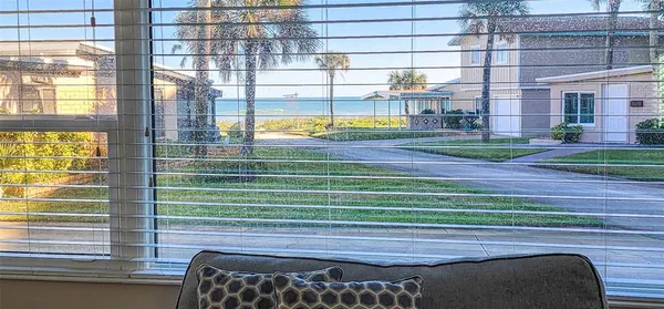a balcony with furniture and a garden