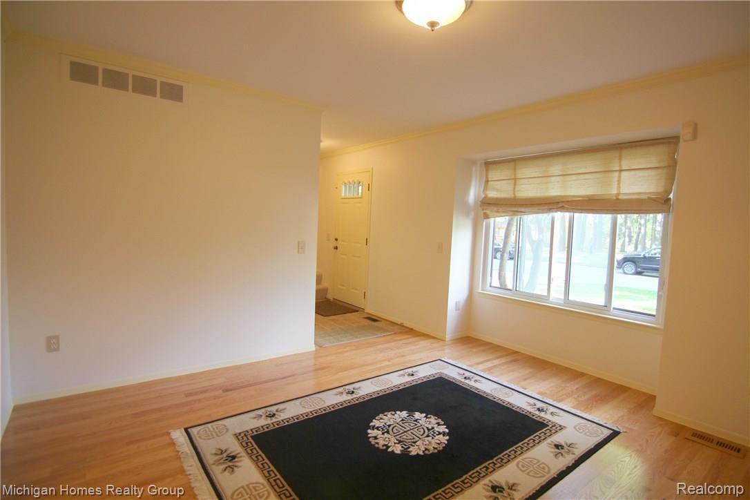 1410 Omega Road Walled Lake, MI 48390 - Photo 15 of 23 Omega Rd Living Room 2.jpg