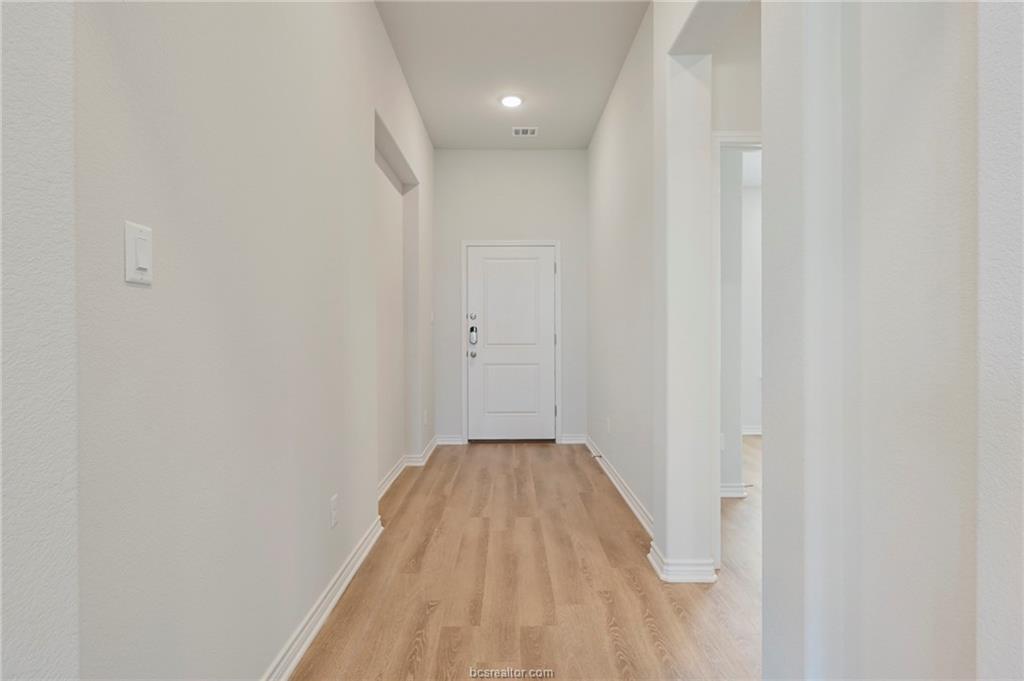 3124 Tarleton Court Bryan, TX 77808 - Photo 2 of 22 a view of a livingroom with wooden floor