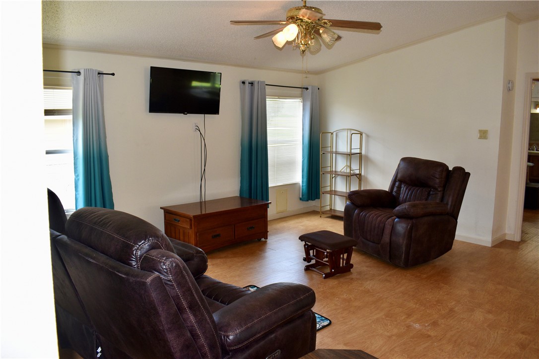 25051 Lake Shore Drive Mathis, TX 78368 - Photo 15 of 40 a living room with furniture and a flat screen tv