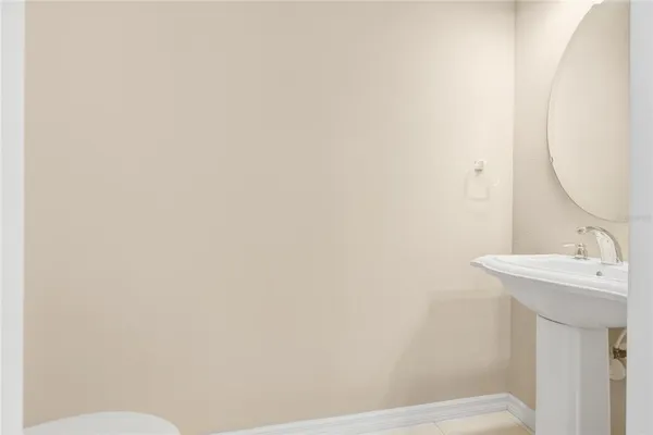 a bathroom with a sink and mirror