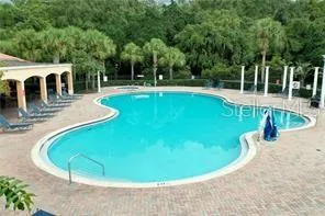 a view of a swimming pool with deck