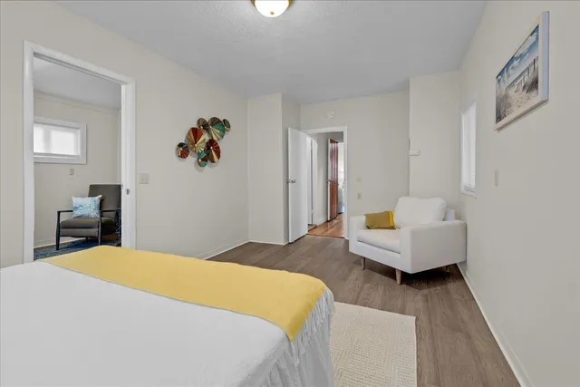 a bedroom with bed and window