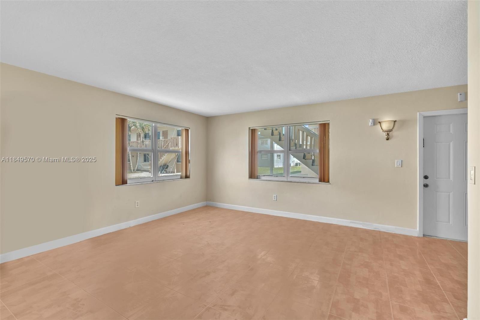 3660 Southwest 60th Avenue, Unit 2 Davie, FL 33314 - Photo 15 of 34 a view of a big room with window and closet
