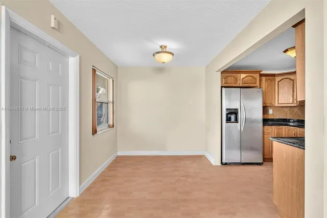 a view of a hallway with wooden shelves