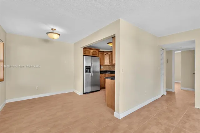 a view of a big room with closet and windows