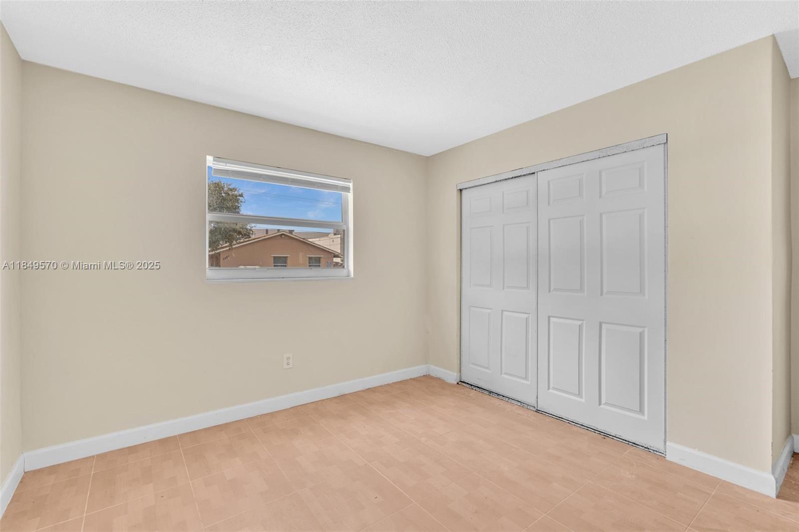 3660 Southwest 60th Avenue, Unit 2 Davie, FL 33314 - Photo 23 of 34 an empty room with windows