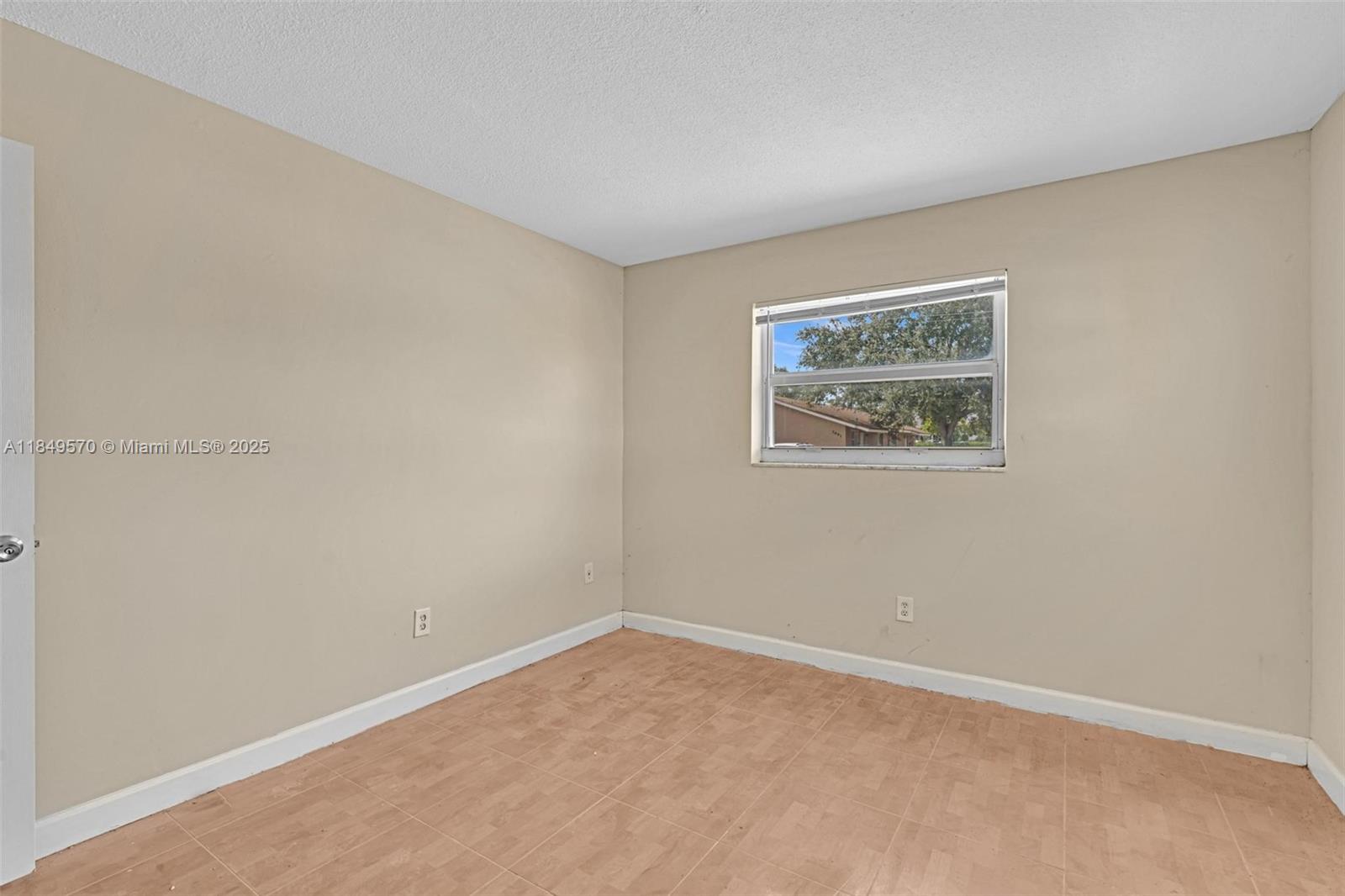 3660 Southwest 60th Avenue, Unit 2 Davie, FL 33314 - Photo 27 of 34 a view of an empty room with a window