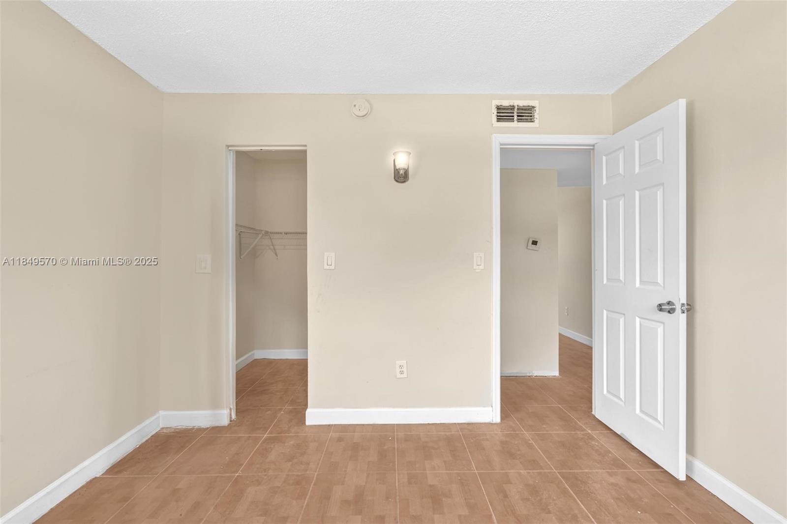 3660 Southwest 60th Avenue, Unit 2 Davie, FL 33314 - Photo 28 of 34 a view of a hallway with wooden floor
