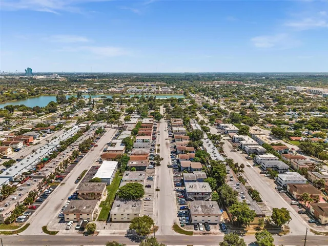 an aerial view of a city with ocean view