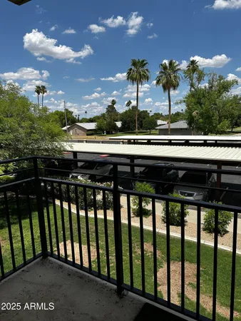 a view of balcony with furniture