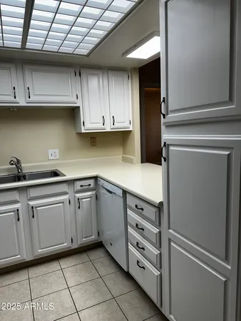 a kitchen with cabinets and appliances