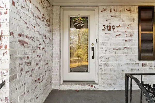 a bathroom with a shower and a window