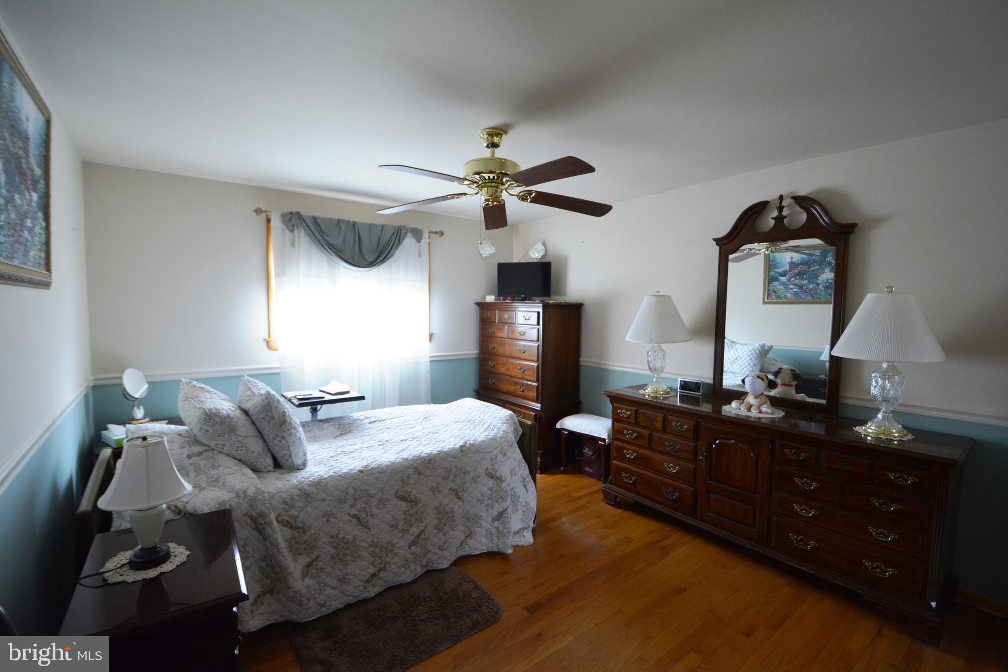 312 Holy Cross Road Baltimore, MD 21225 - Photo 13 of 68 Bedroom 1 , gleaming hardwood floors.