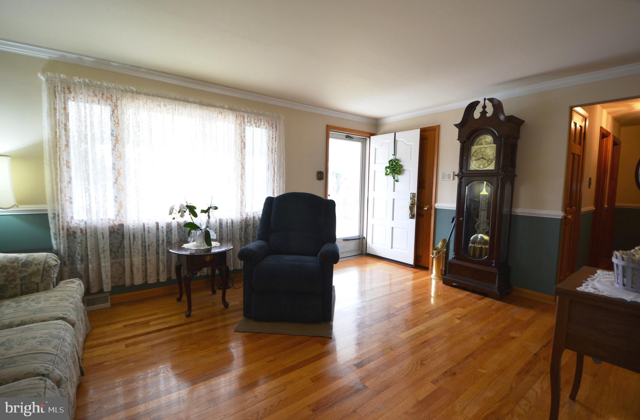 312 Holy Cross Road Baltimore, MD 21225 - Photo 23 of 68 Living room, gleaming hardwood floors!