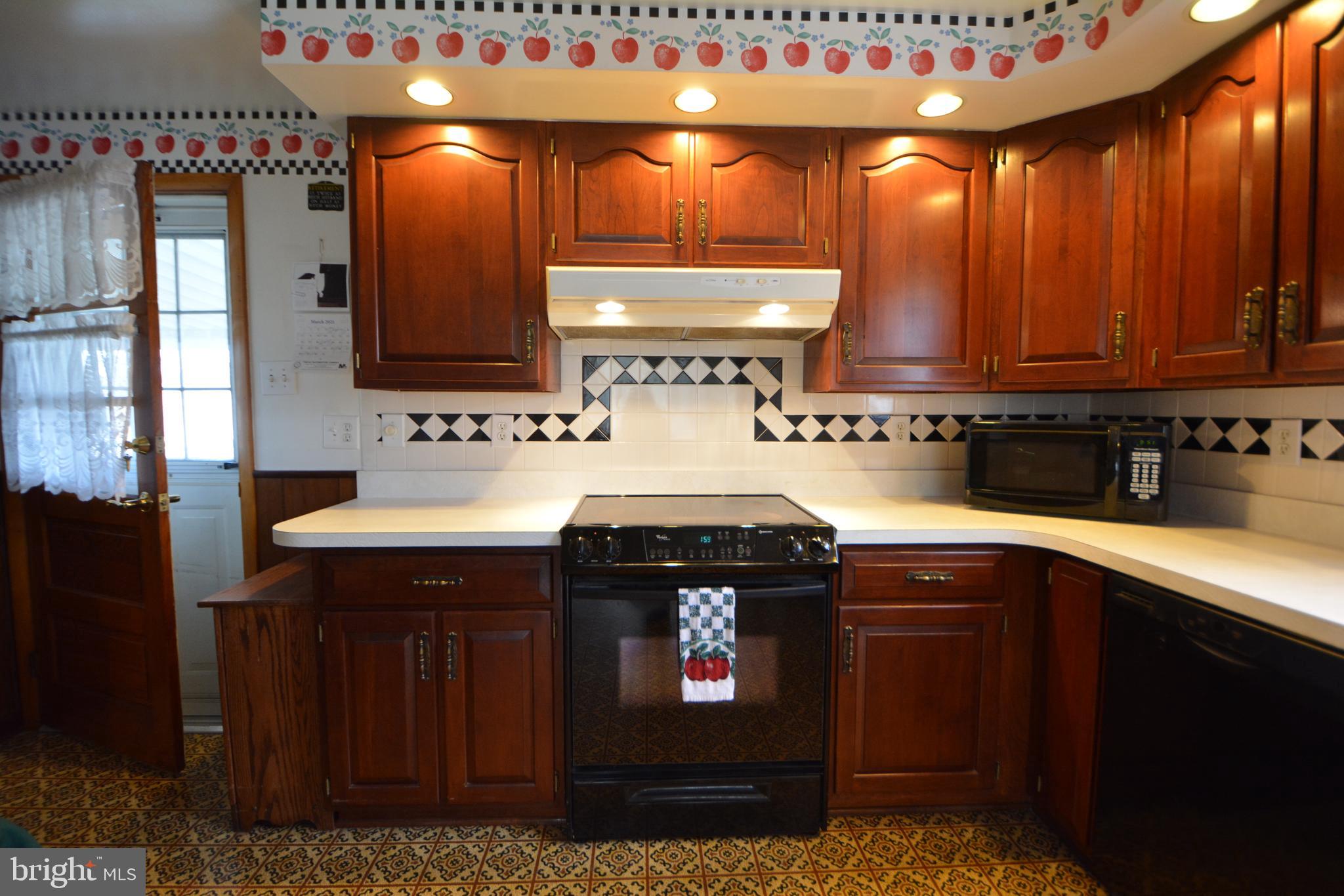 312 Holy Cross Road Baltimore, MD 21225 - Photo 32 of 68 Kitchen door to large roof covered deck!