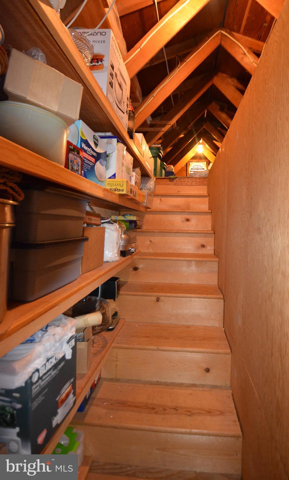312 Holy Cross Road Baltimore, MD 21225 - Photo 41 of 68 Atiic storage shelving