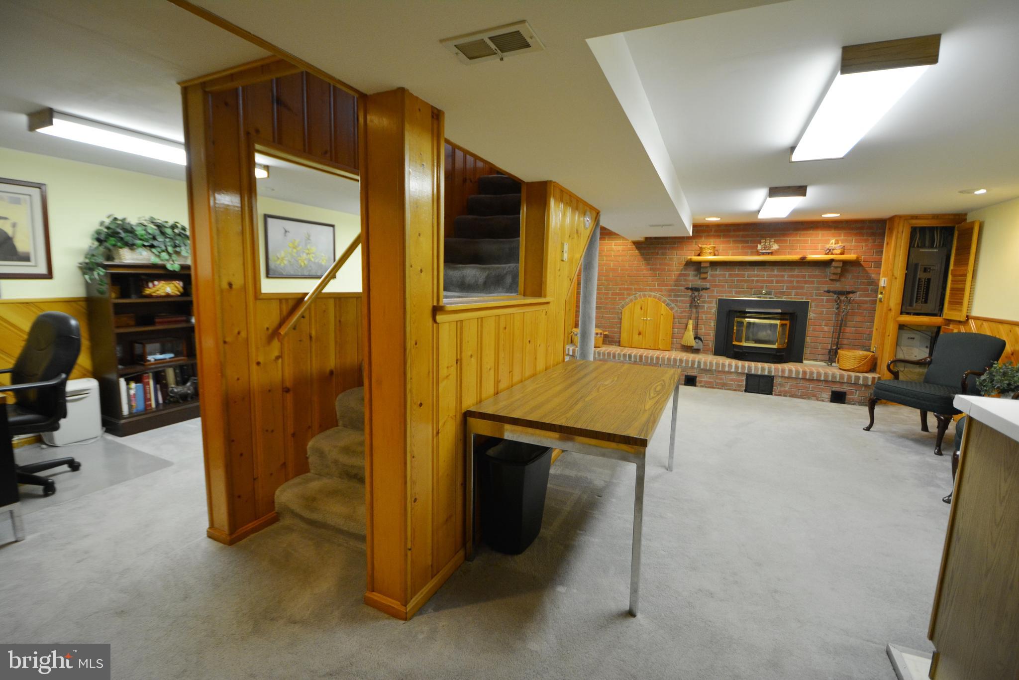 312 Holy Cross Road Baltimore, MD 21225 - Photo 52 of 68 Wide view of bright family room w/ gray carpet
