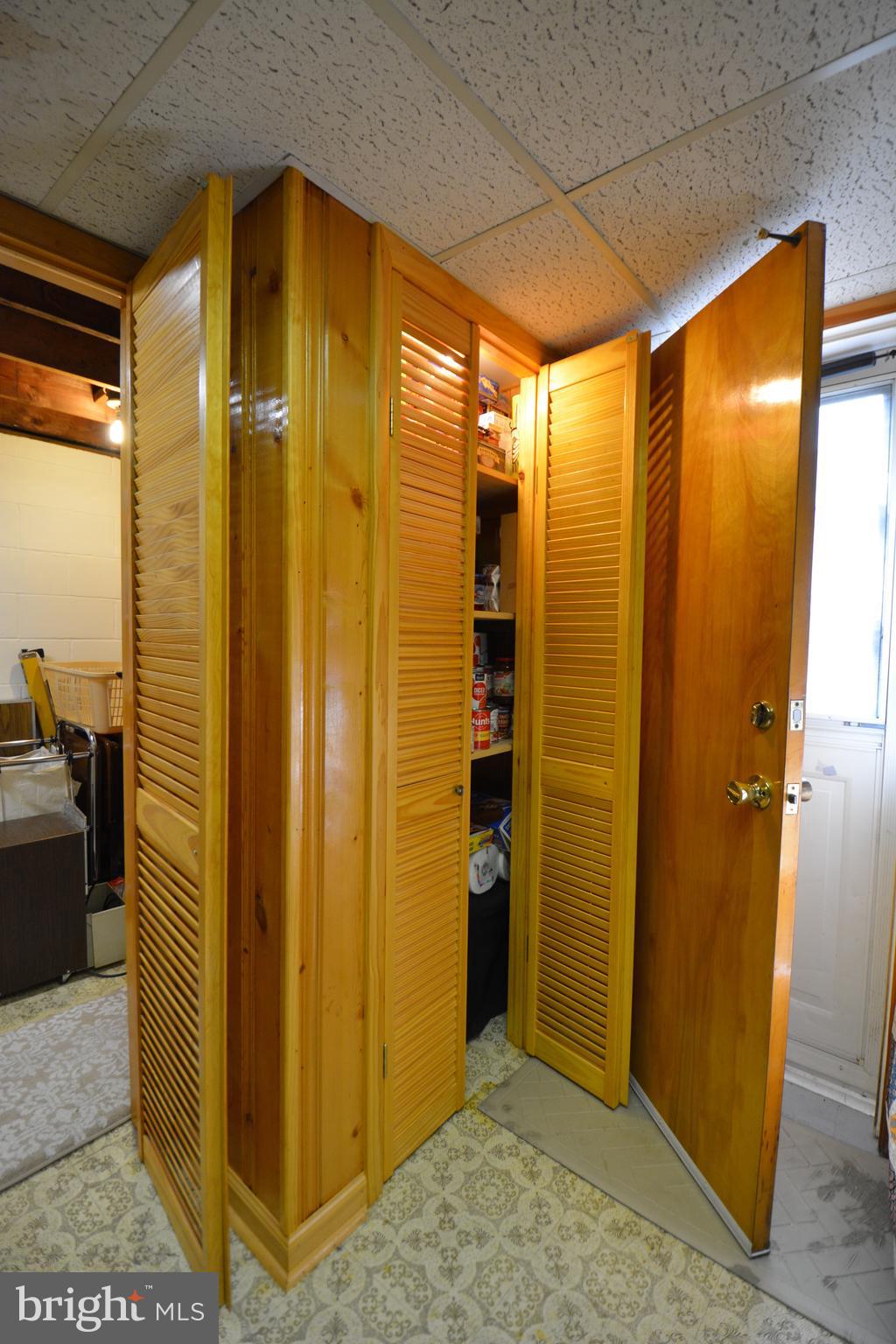 312 Holy Cross Road Baltimore, MD 21225 - Photo 54 of 68 Pantry closet w/ light in storage room