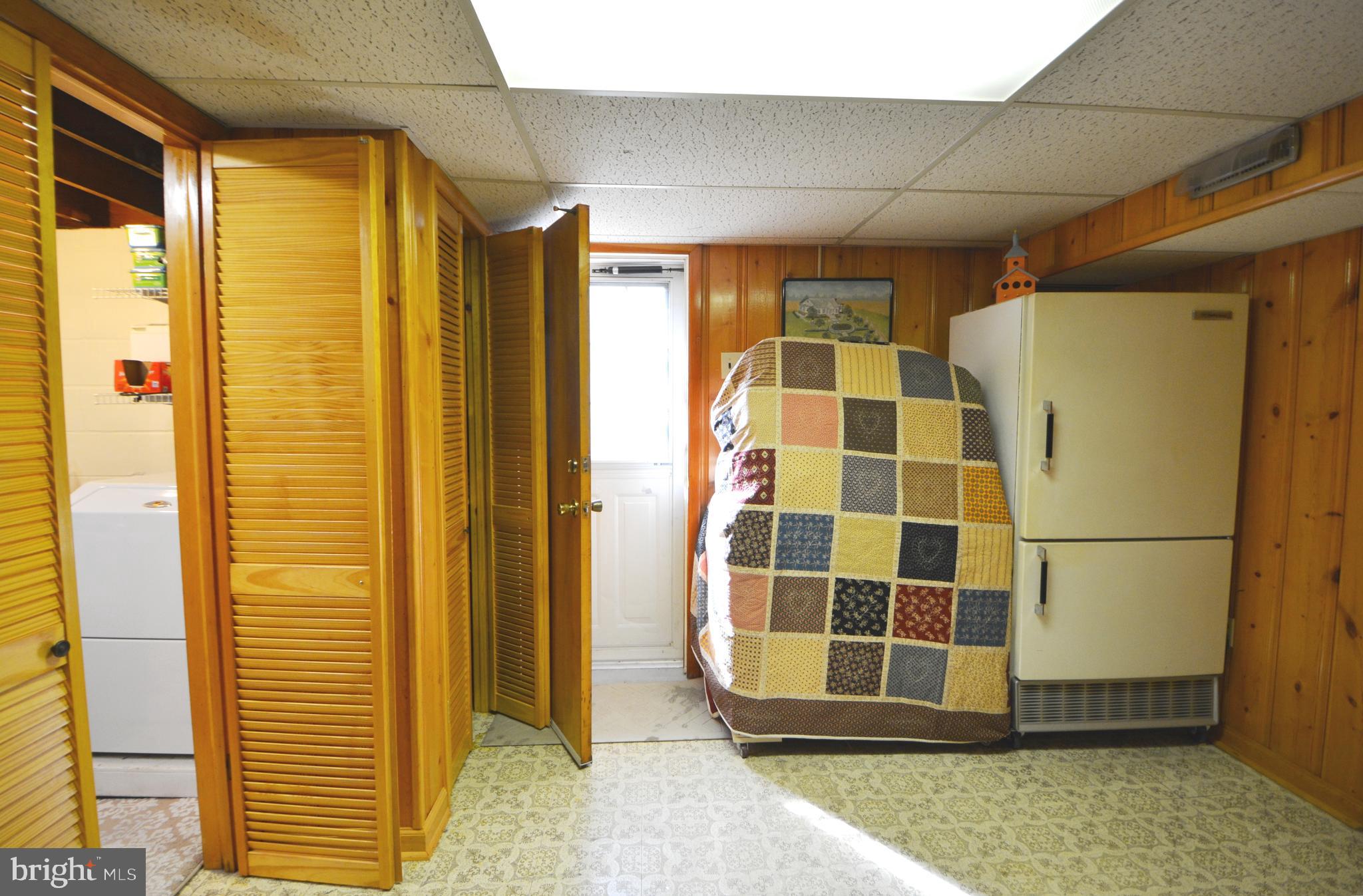 312 Holy Cross Road Baltimore, MD 21225 - Photo 55 of 68 Extra refrigerator stays. Storage room exit door.