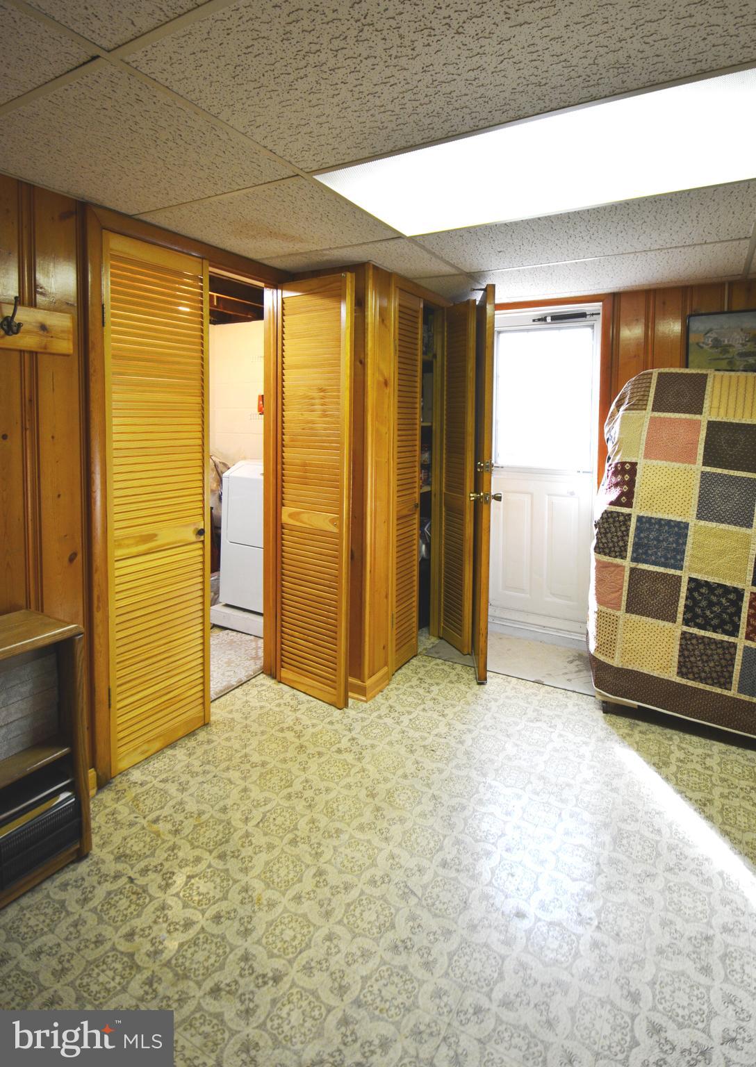 312 Holy Cross Road Baltimore, MD 21225 - Photo 59 of 68 Basement storage room shows exit door