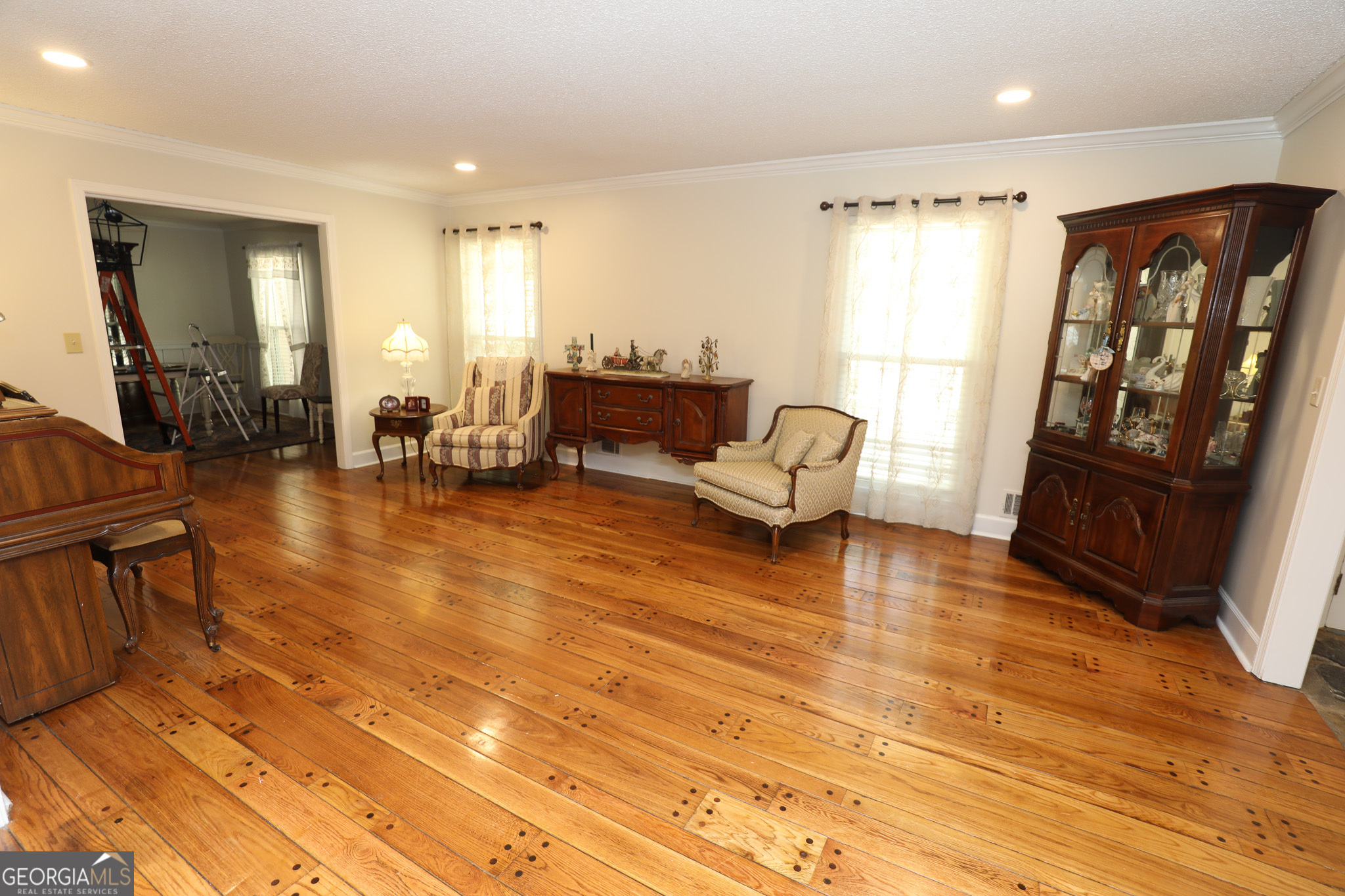 1017 Dr Bruce Jackson Road Newnan, GA 30263 - Photo 18 of 52 a living room with furniture and a wooden floor
