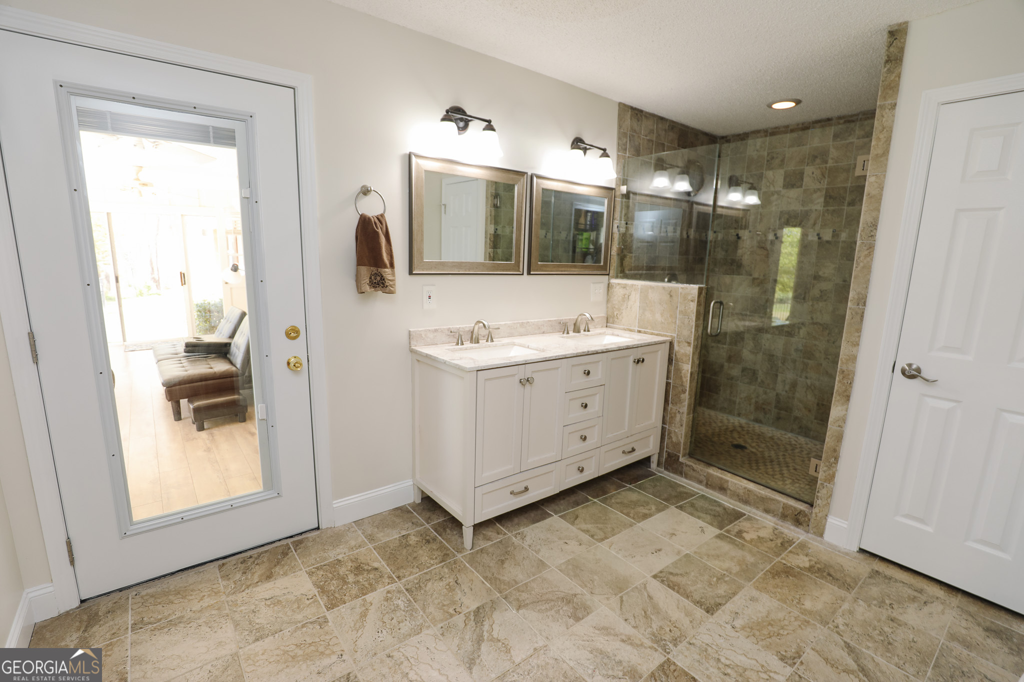 1017 Dr Bruce Jackson Road Newnan, GA 30263 - Photo 20 of 52 a bathroom with a mirror sink and glass door shower