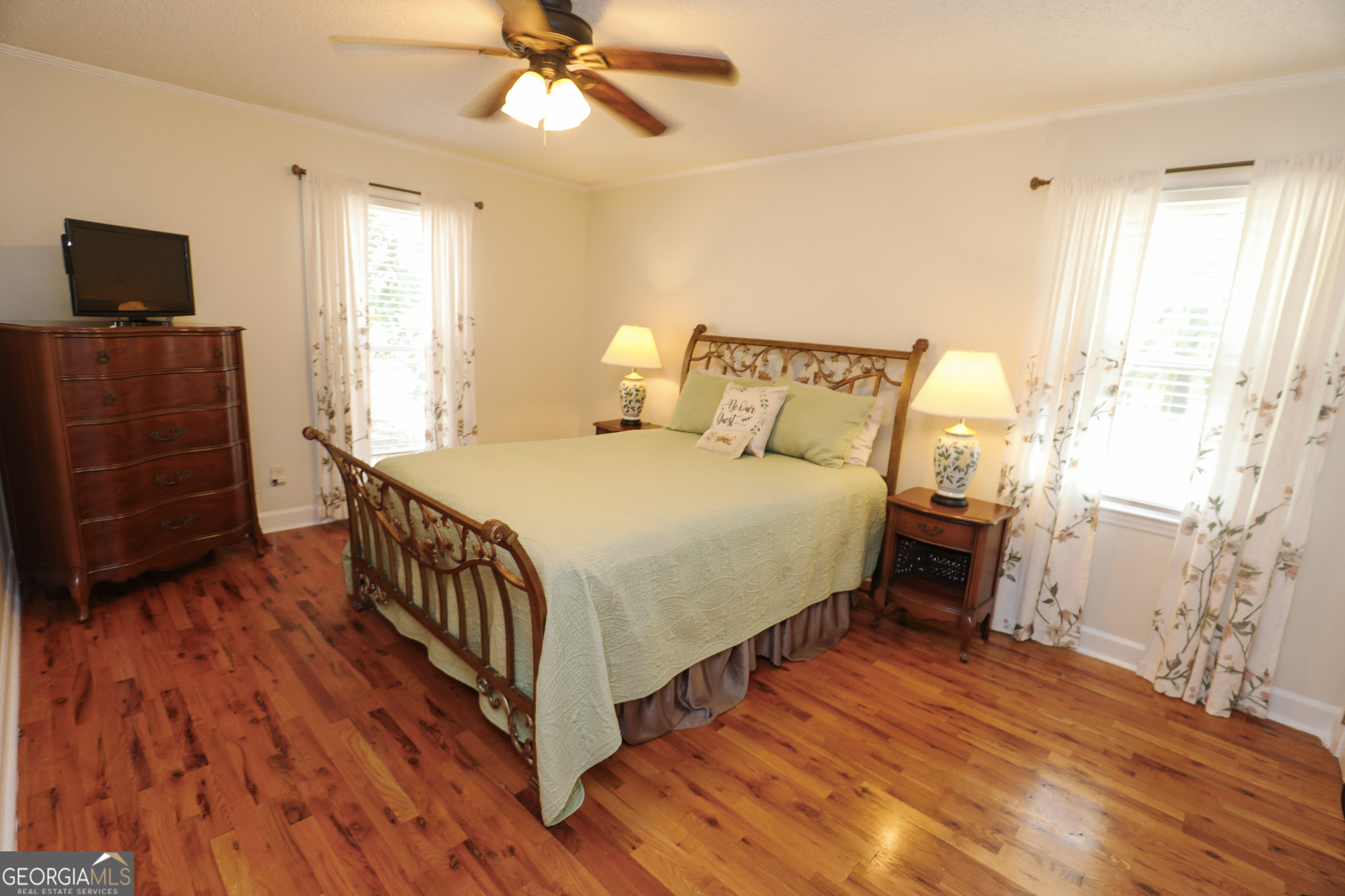 1017 Dr Bruce Jackson Road Newnan, GA 30263 - Photo 23 of 52 a bedroom with a bed and wooden floor