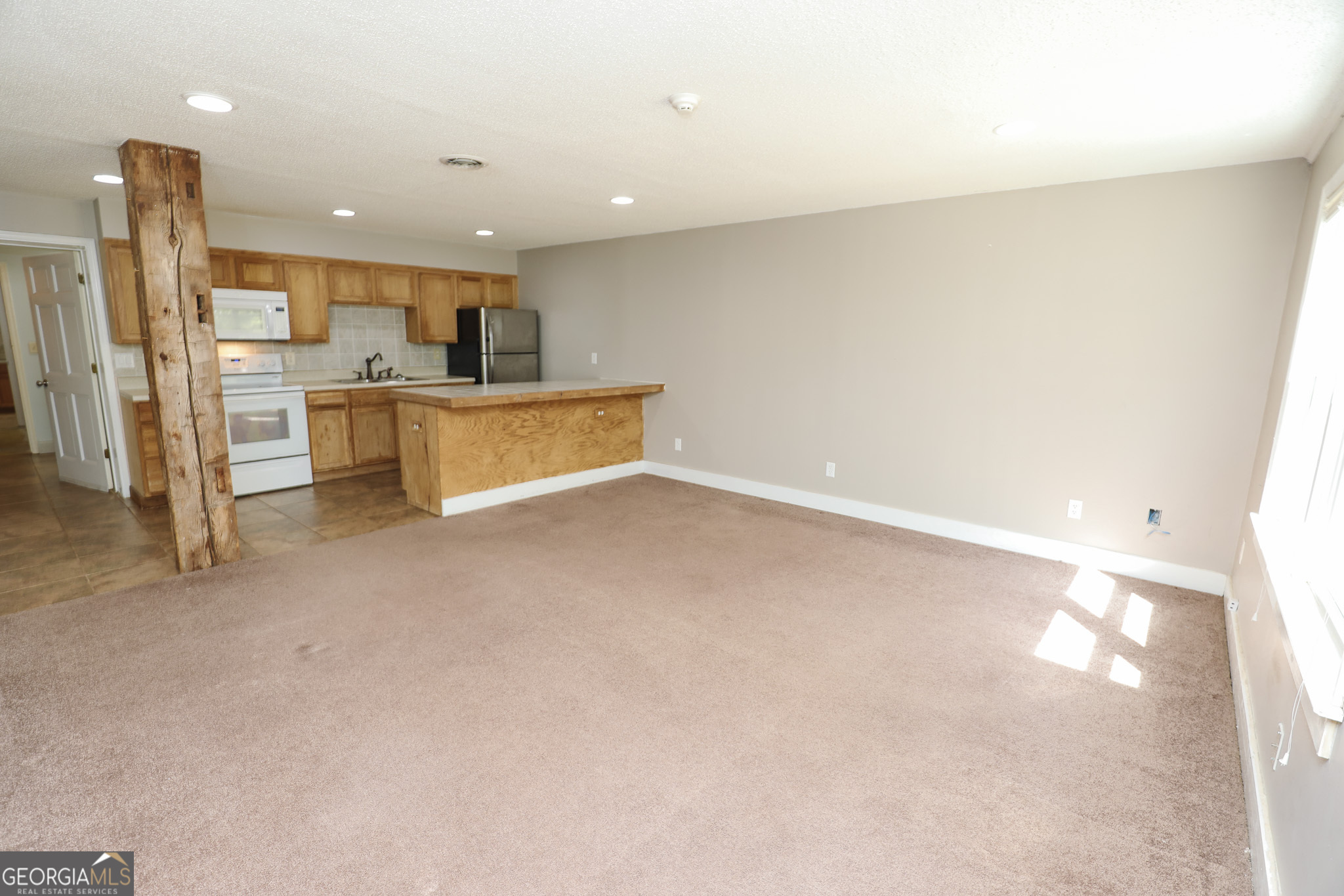 1017 Dr Bruce Jackson Road Newnan, GA 30263 - Photo 25 of 52 a view of kitchen with refrigerator sink and cabinets