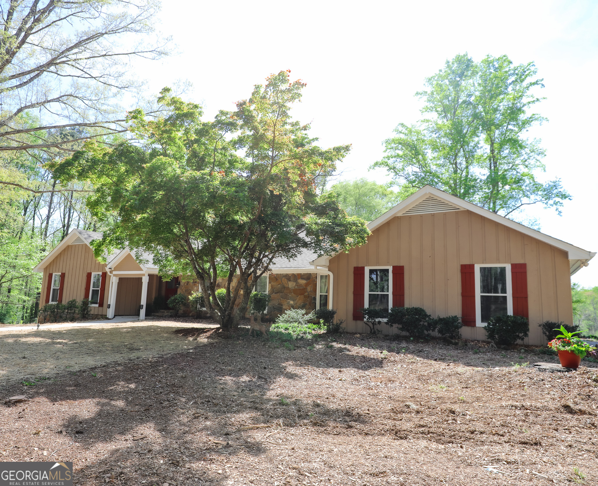 1017 Dr Bruce Jackson Road Newnan, GA 30263 - Photo 3 of 52 a view of a yard in front of a house with large trees