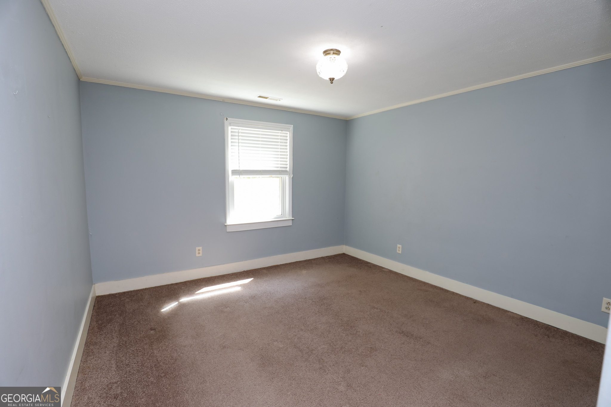 1017 Dr Bruce Jackson Road Newnan, GA 30263 - Photo 34 of 52 an empty room with a window