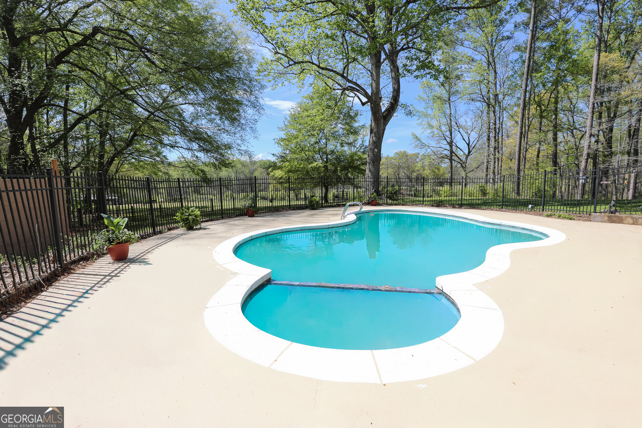 1017 Dr Bruce Jackson Road Newnan, GA 30263 - Photo 35 of 52 a view of a swimming pool with a sitting area