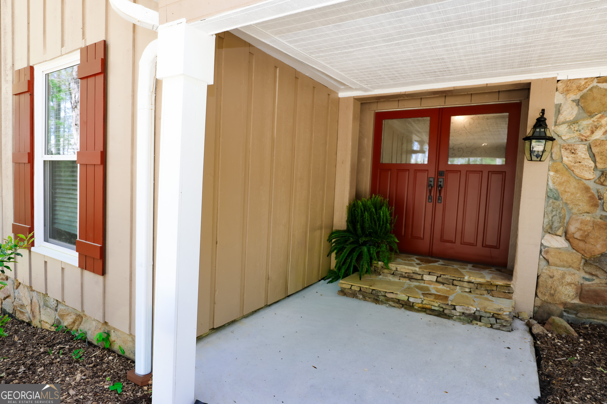 1017 Dr Bruce Jackson Road Newnan, GA 30263 - Photo 4 of 52 a view of a front door and wooden door