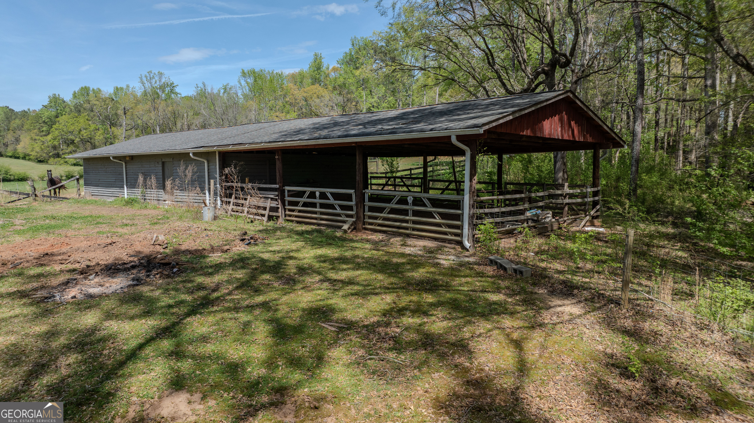 1017 Dr Bruce Jackson Road Newnan, GA 30263 - Photo 45 of 52 a backyard of a house with barbeque oven and outdoor seating