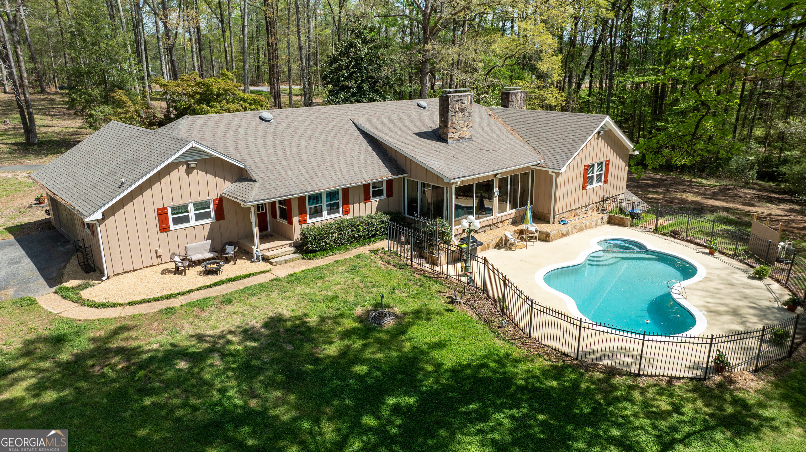 1017 Dr Bruce Jackson Road Newnan, GA 30263 - Photo 49 of 52 a aerial view of a house with table and chairs
