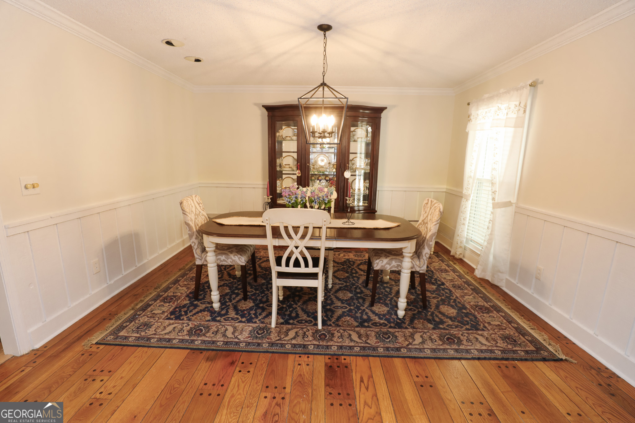 1017 Dr Bruce Jackson Road Newnan, GA 30263 - Photo 9 of 52 a dining room with furniture window and wooden floor
