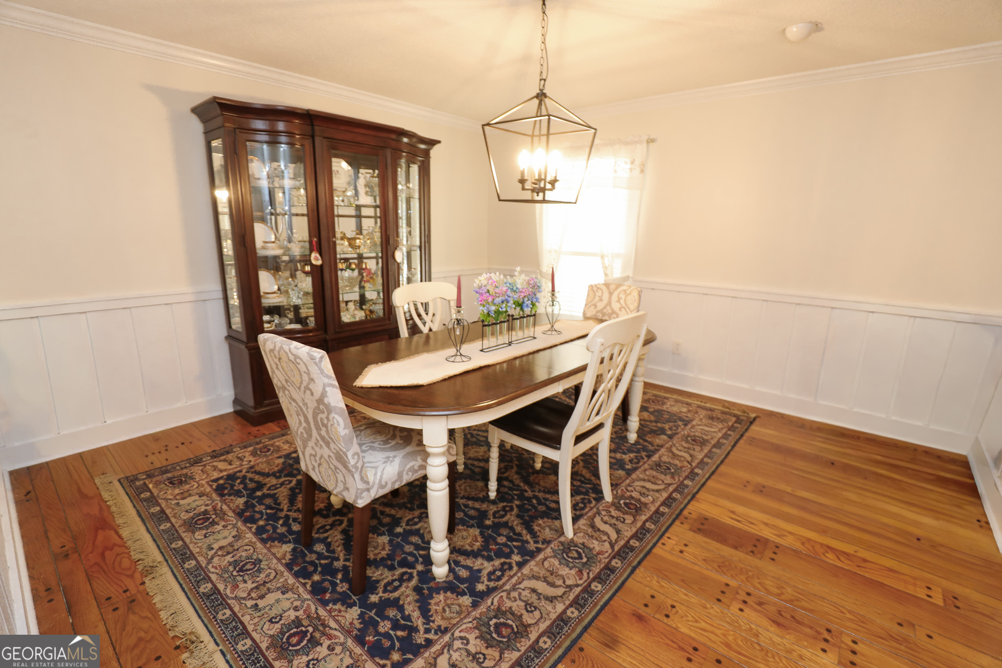 1017 Dr Bruce Jackson Road Newnan, GA 30263 - Photo 10 of 52 a view of a dining room with furniture window and wooden floor