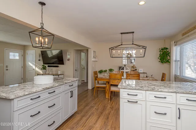 a view of living room with granite countertop furniture and fireplace