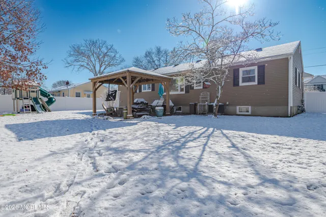 a view of a house with a snow in a yard