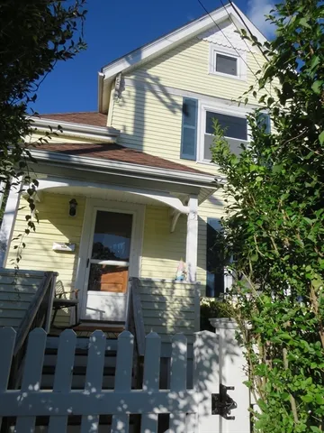 a view of a house with a tree