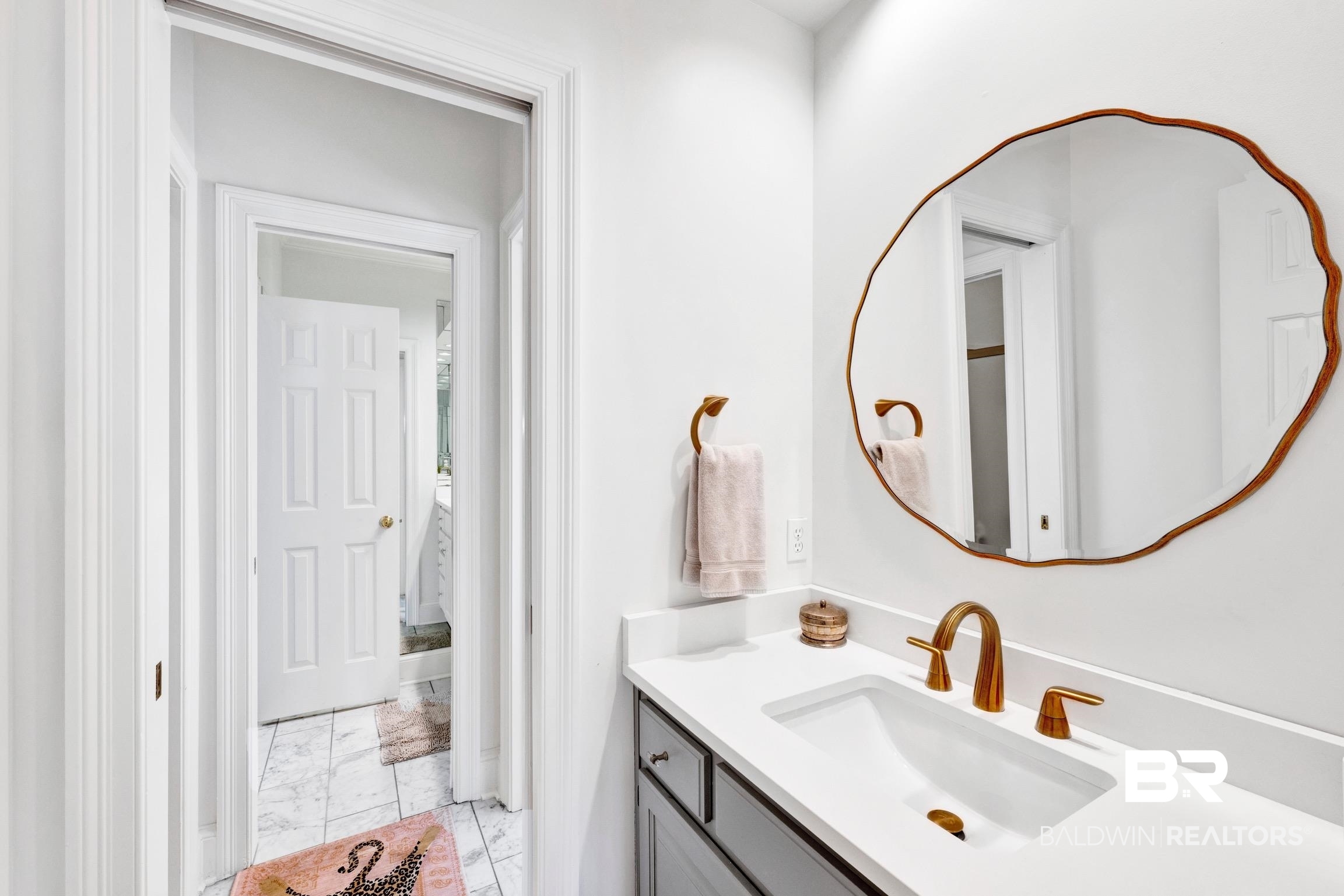 4 Savannah Court Mobile, AL 36608 - Photo 21 of 32 Bathroom featuring vanity and light marble finish floors