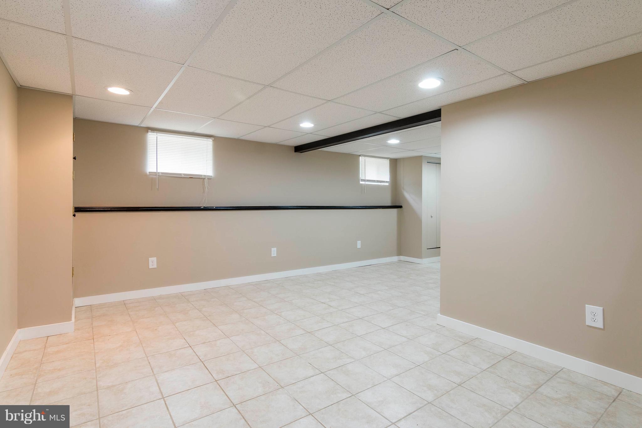 610 McHenry Road Baltimore, MD 21208 - Photo 22 of 27 Lower level Family room - tile floor