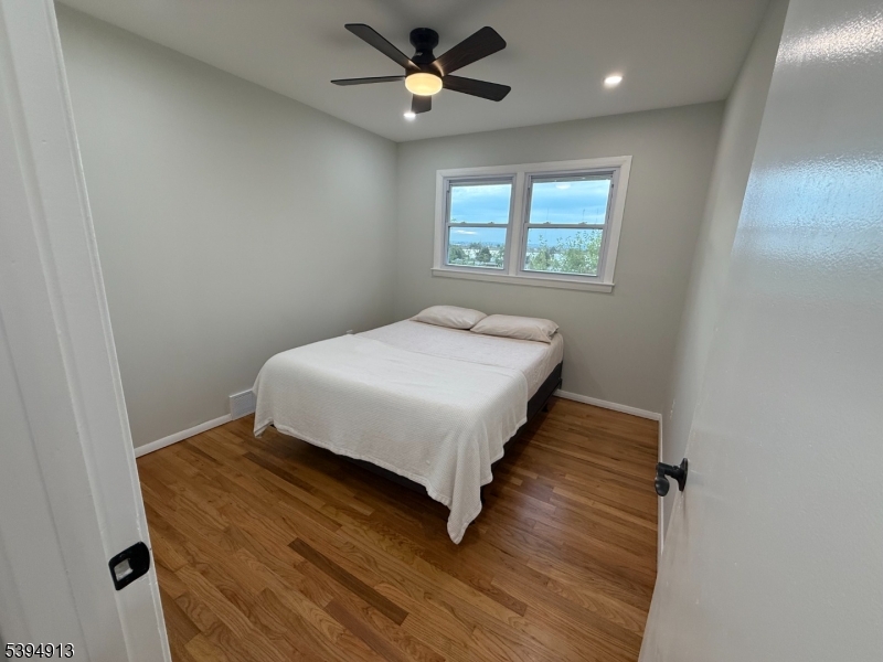 691 9th Street Secaucus, NJ 07094 - Photo 10 of 12 a bedroom with a bed and a window
