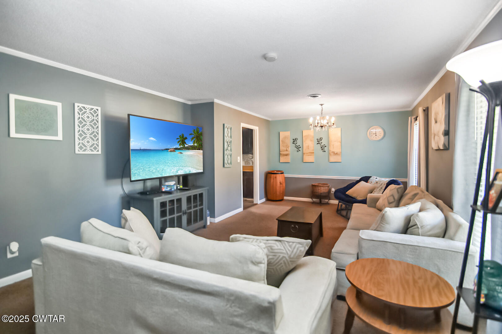 152 Whitfield Drive Jackson, TN 38305 - Photo 2 of 17 a living room with furniture and a flat screen tv