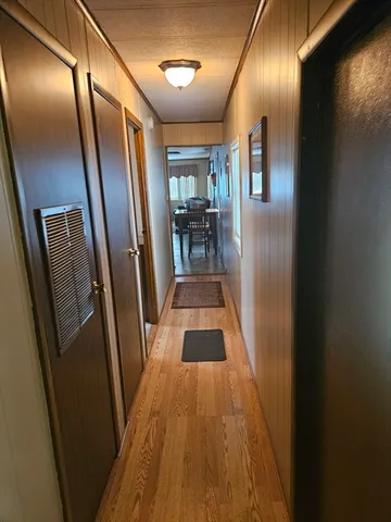 a view of gallery with wooden floor